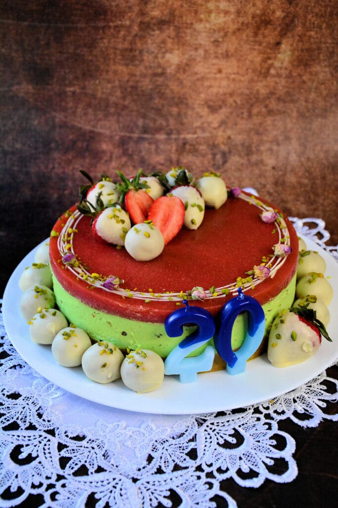 Creamy pistachio cheesecake with strawberry topping